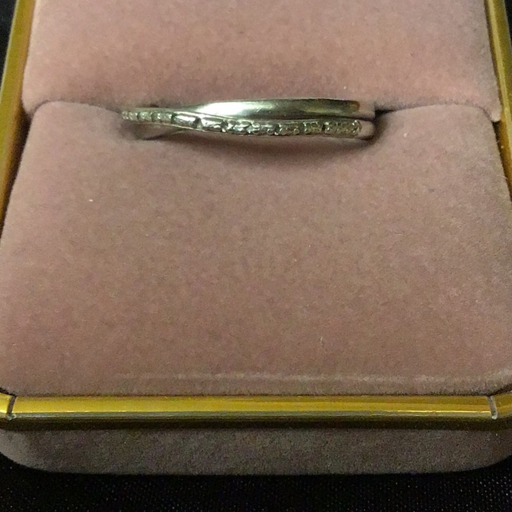 Genuine diamond and sterling silver ring.